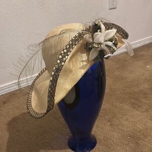 Elegant Cream Hat with Feather and Floral Accents